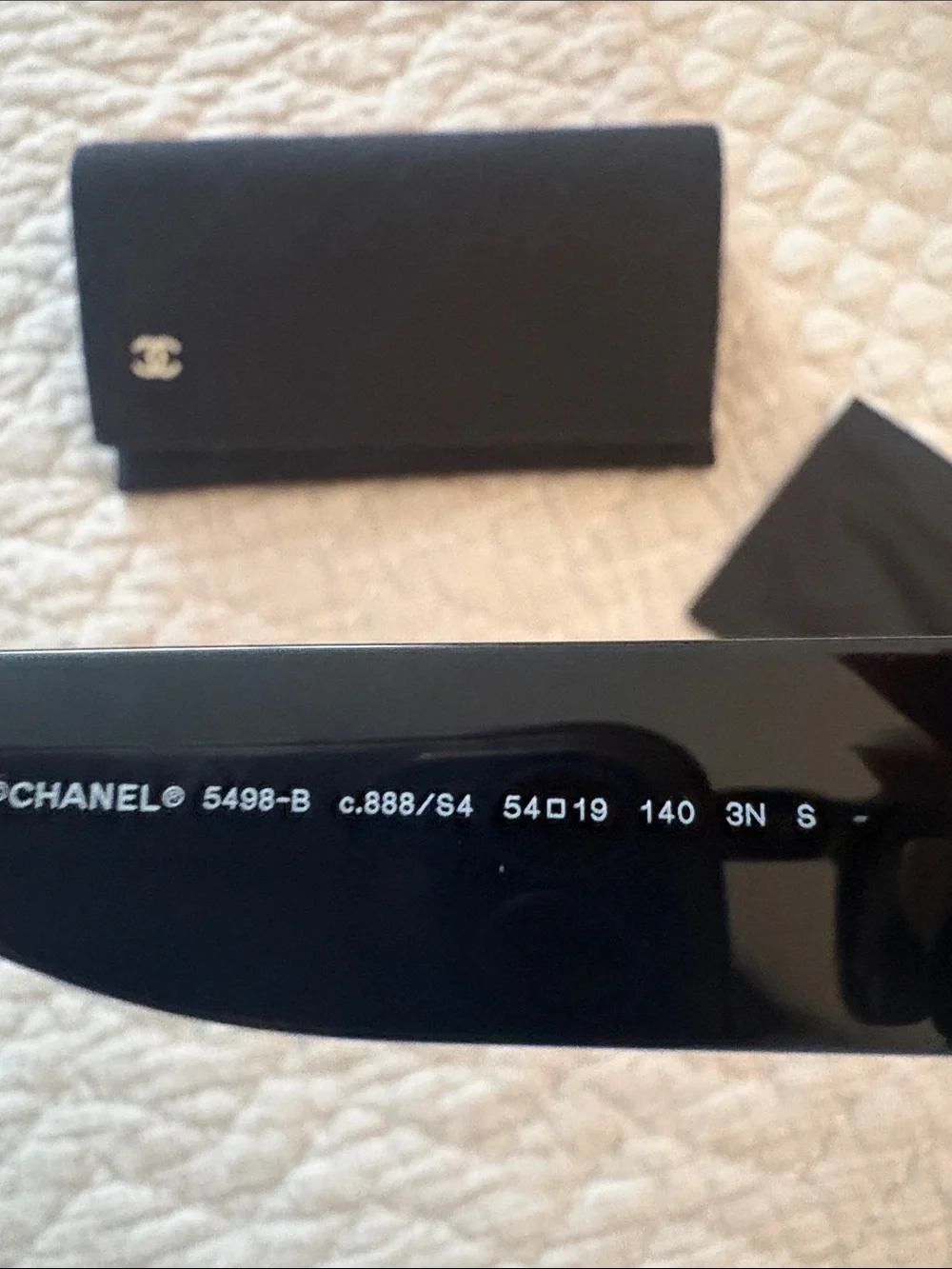 CHANEL Black Cat-Eye Sunglasses with Dark Lenses